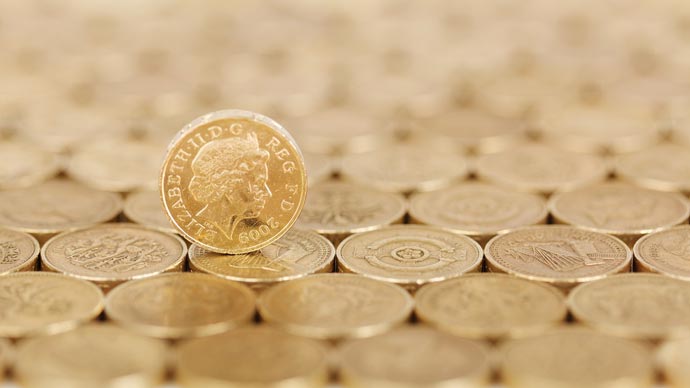 Photo of a layer of neatly aligned pound coins