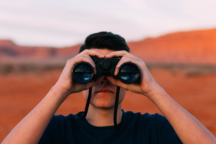 person using binoculars